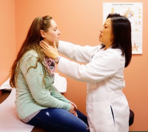 Pain management specialist Dr. Hyon Schneider with a patient